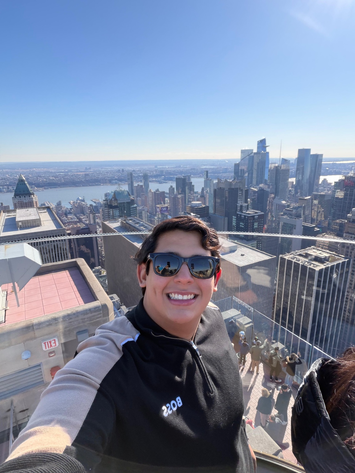 Juan smiling at a New York City observation deck